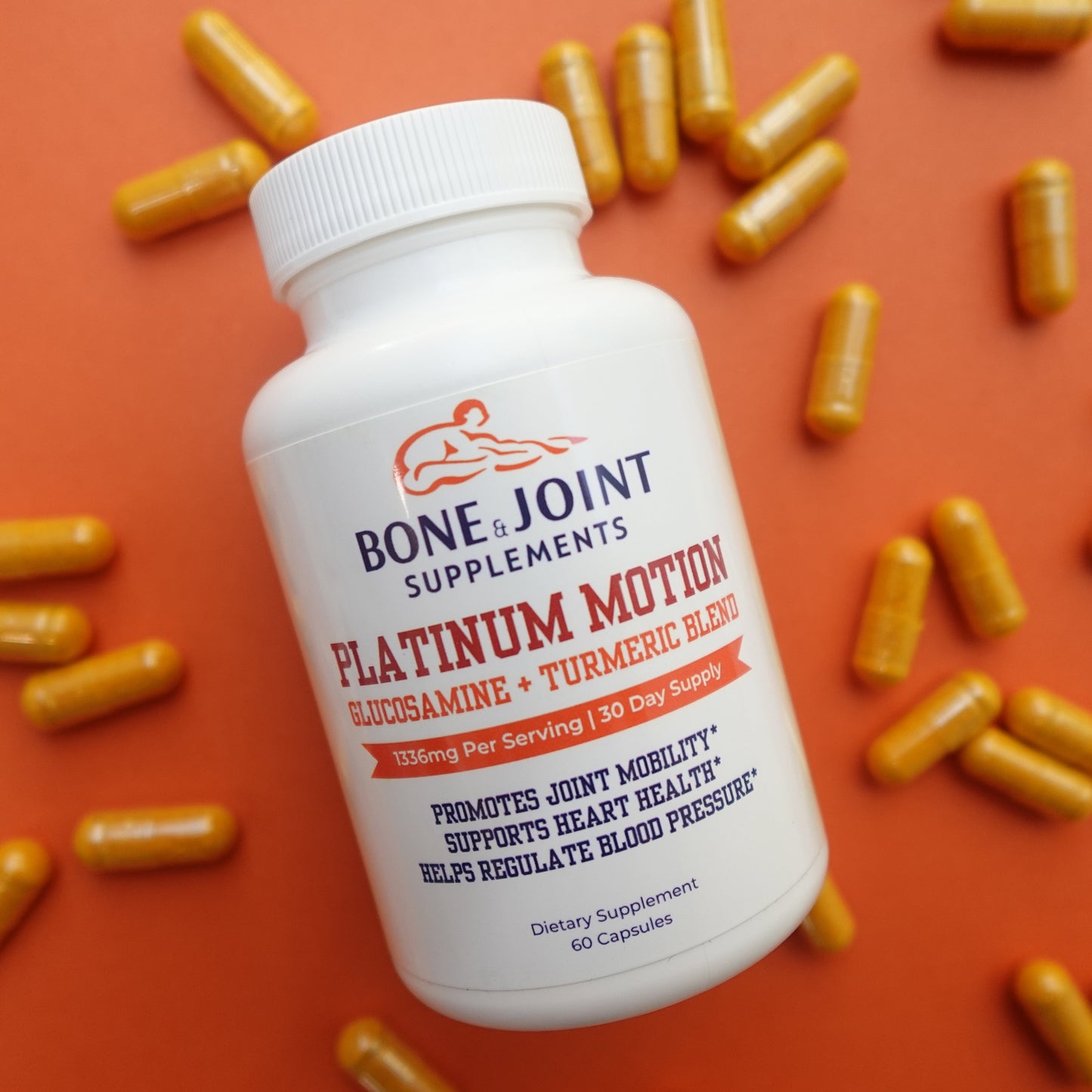 Bone & Joint Supplements bottle labeled 'Platinum Motion' with scattered capsules on an orange background