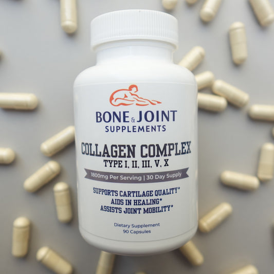Supplement bottle labeled 'Bone Joint' with scattered capsules on a light gray background