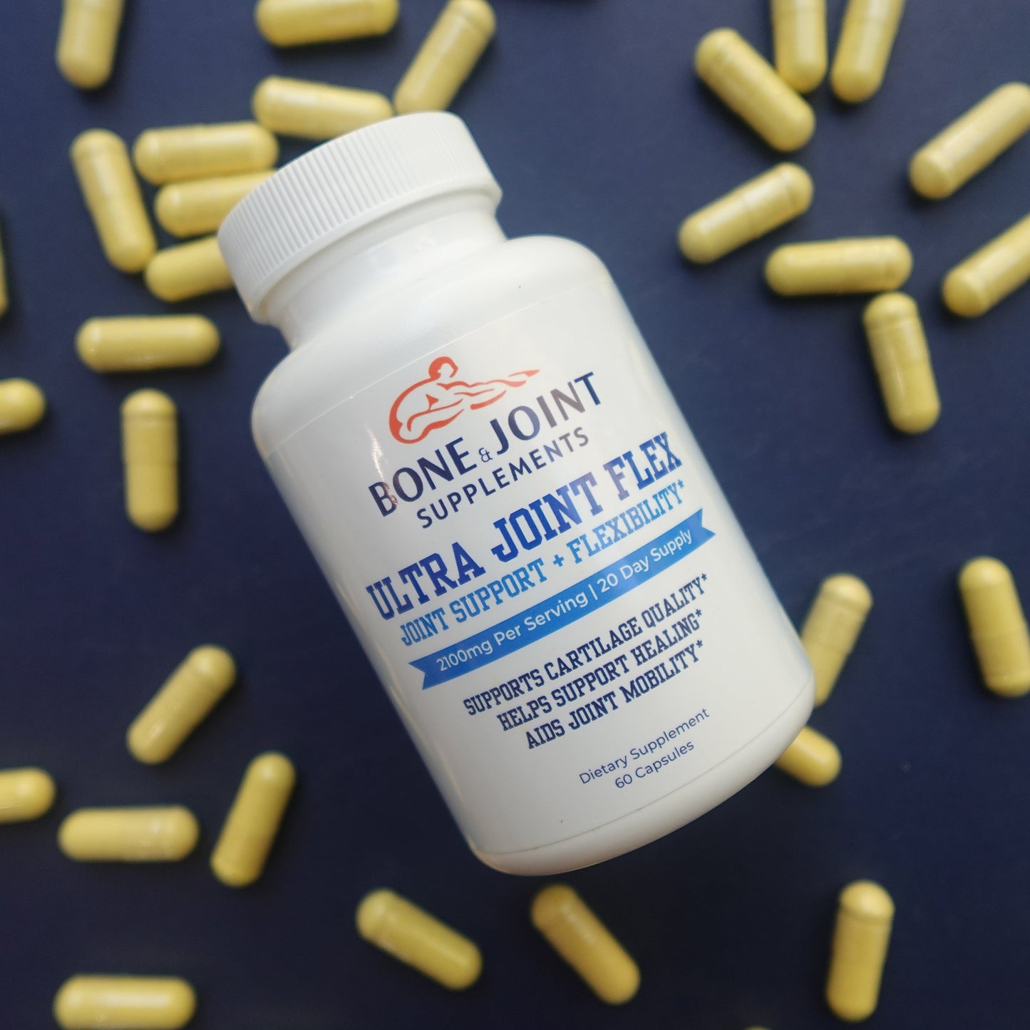 Bone & Joint supplement bottle with scattered capsules on a dark background